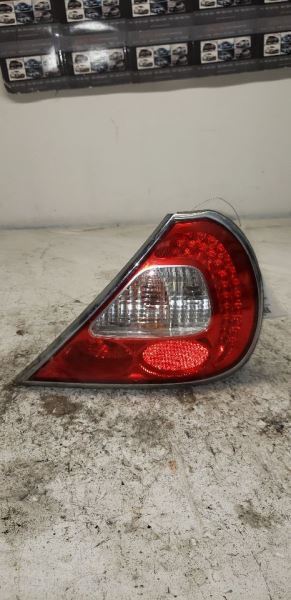 04-06 JAGUAR XJ8 Passenger Tail Light Thru VIN H01625 Chrome Bezel AA 121584